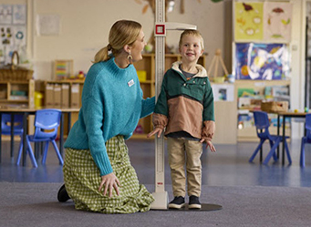 boy getting measured